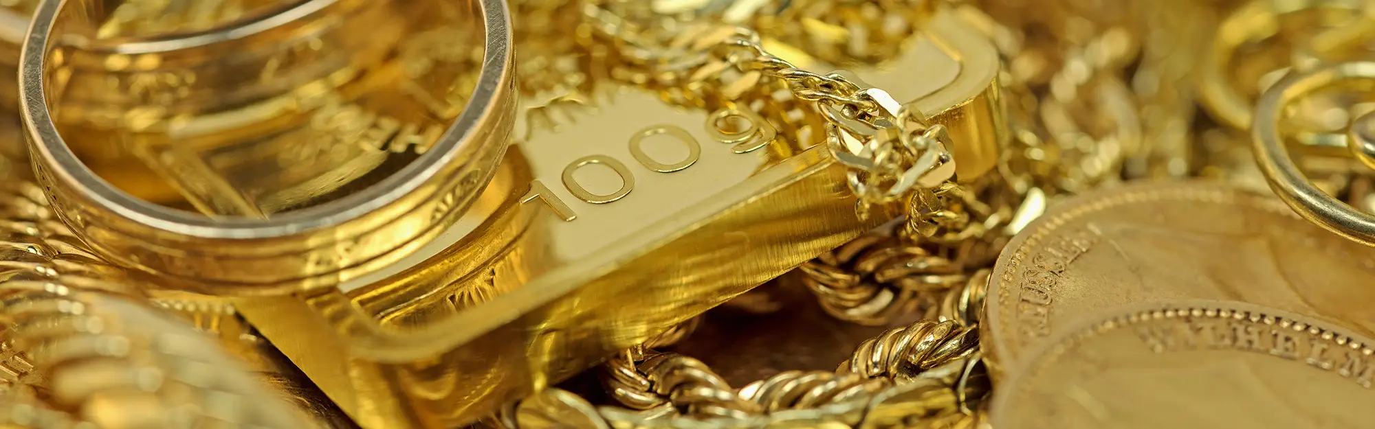 Goldschmuck, Goldbarren und Goldmünzen