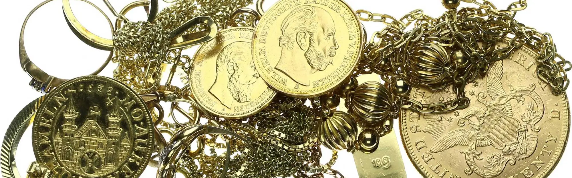 Verschiedene Goldmünzen und Goldschmuck